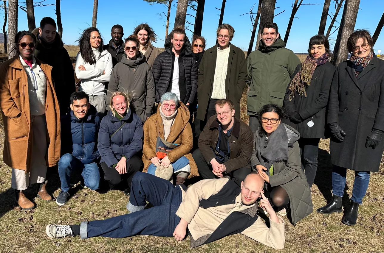 Group image of PhD students outdoors. Photo.