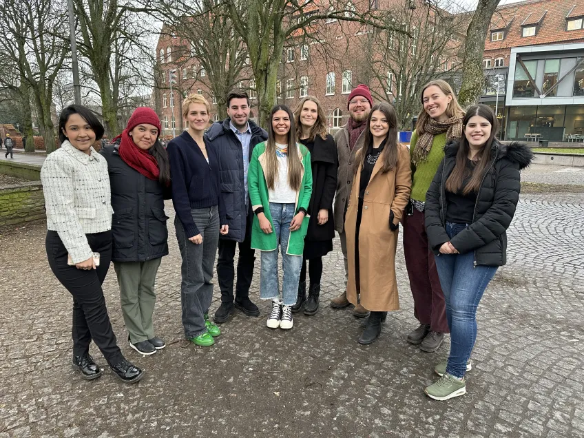 A group photo with ten people, outdoors. Photo
